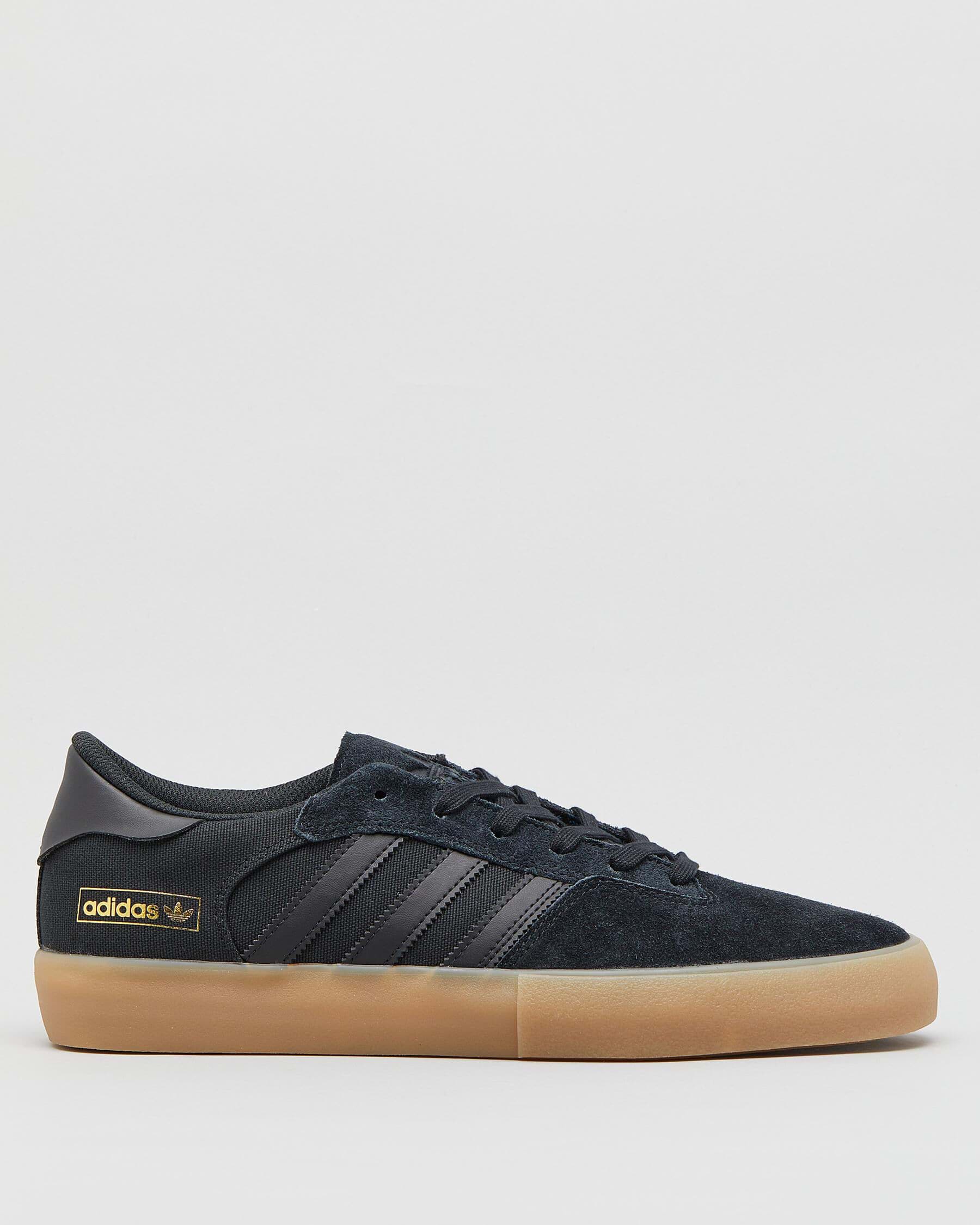 black adidas with brown sole