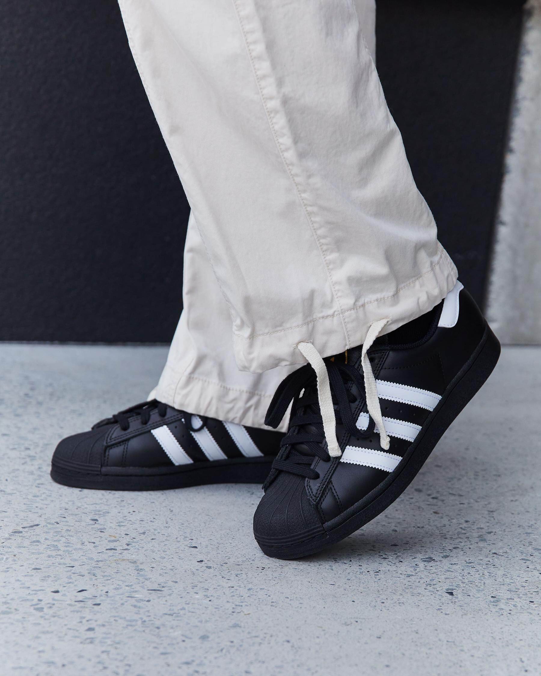 Adidas superstar black and white outlet nz