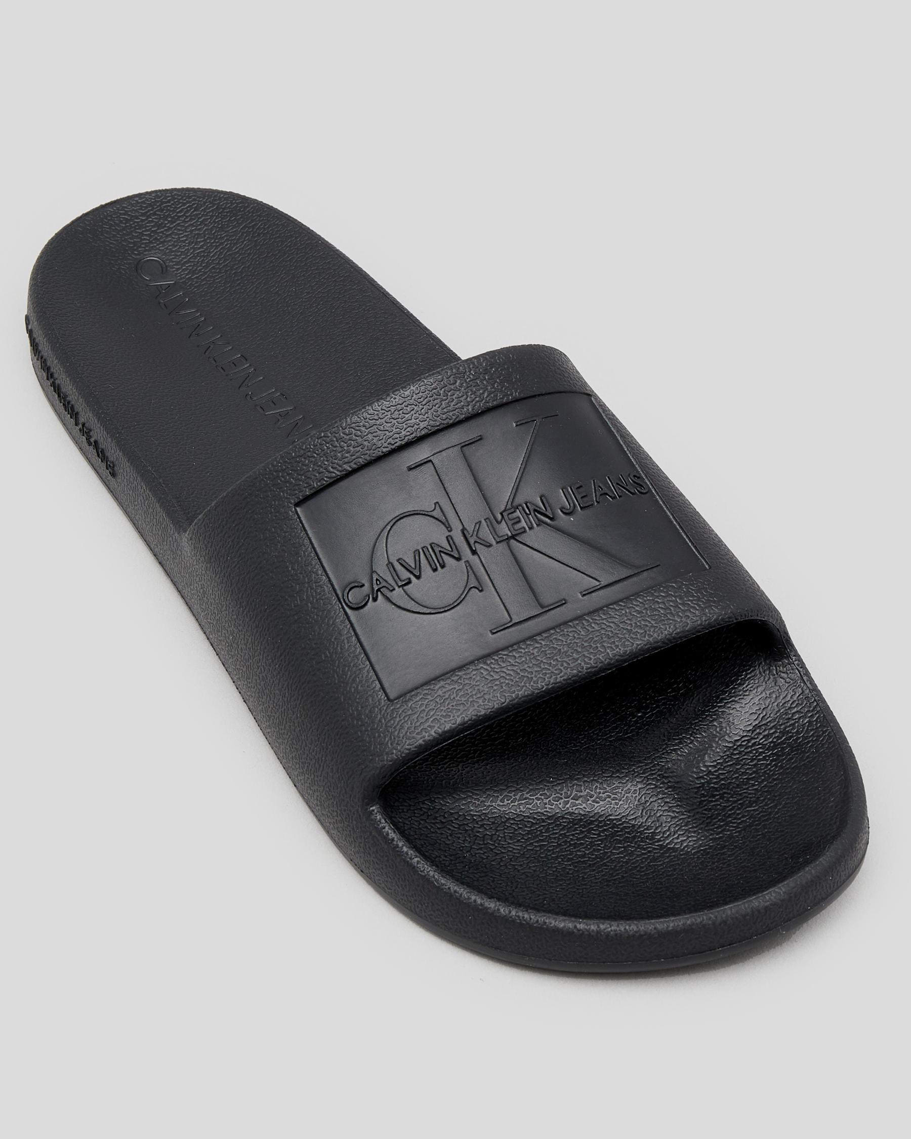 Shop Calvin Klein Debossed Eva Slide Sandals In Black - Fast Shipping ...
