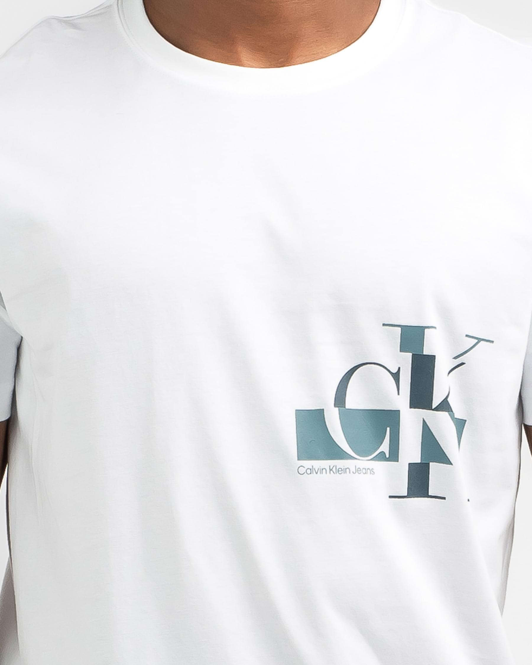 Shop Calvin Klein Glitched CK Logo T-Shirt In Bright White - Fast ...