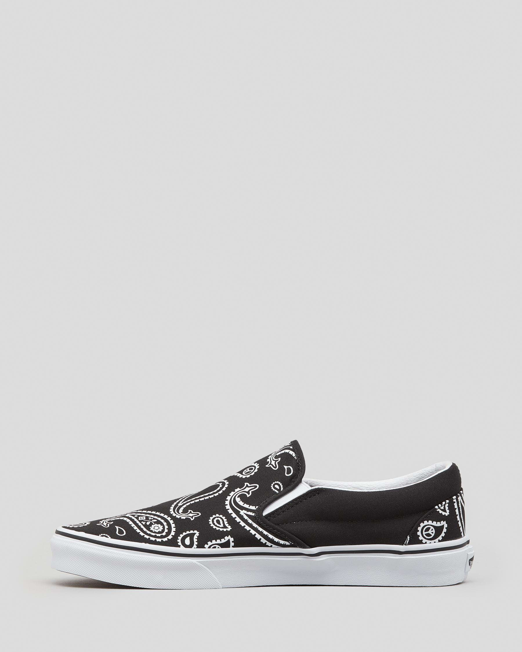 Shop Vans Classic Slip-On Shoes In Black/true White - Fast Shipping ...