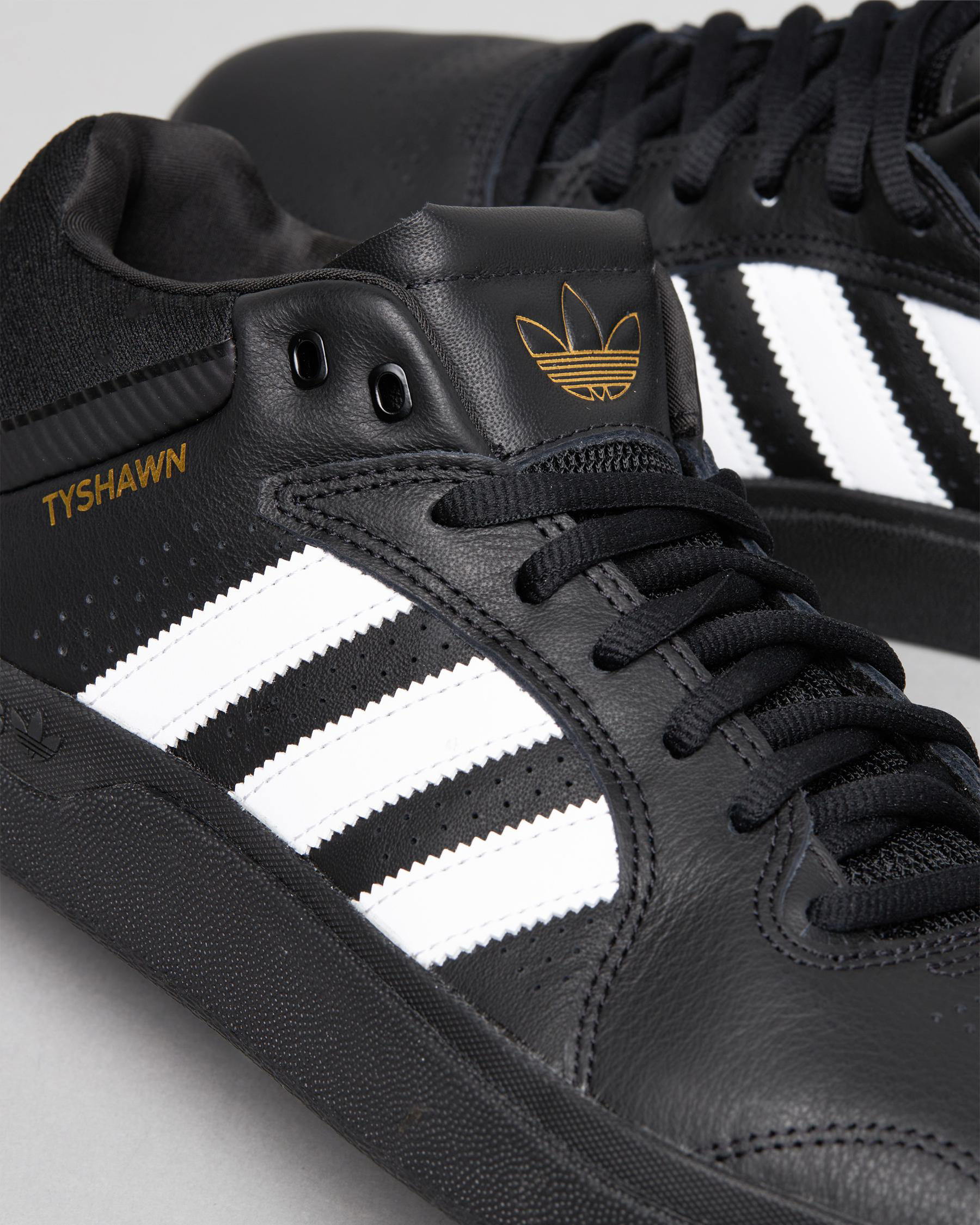 Shop adidas Tyshawn Shoes In Core Black/ftwr White/gold Met - Fast ...
