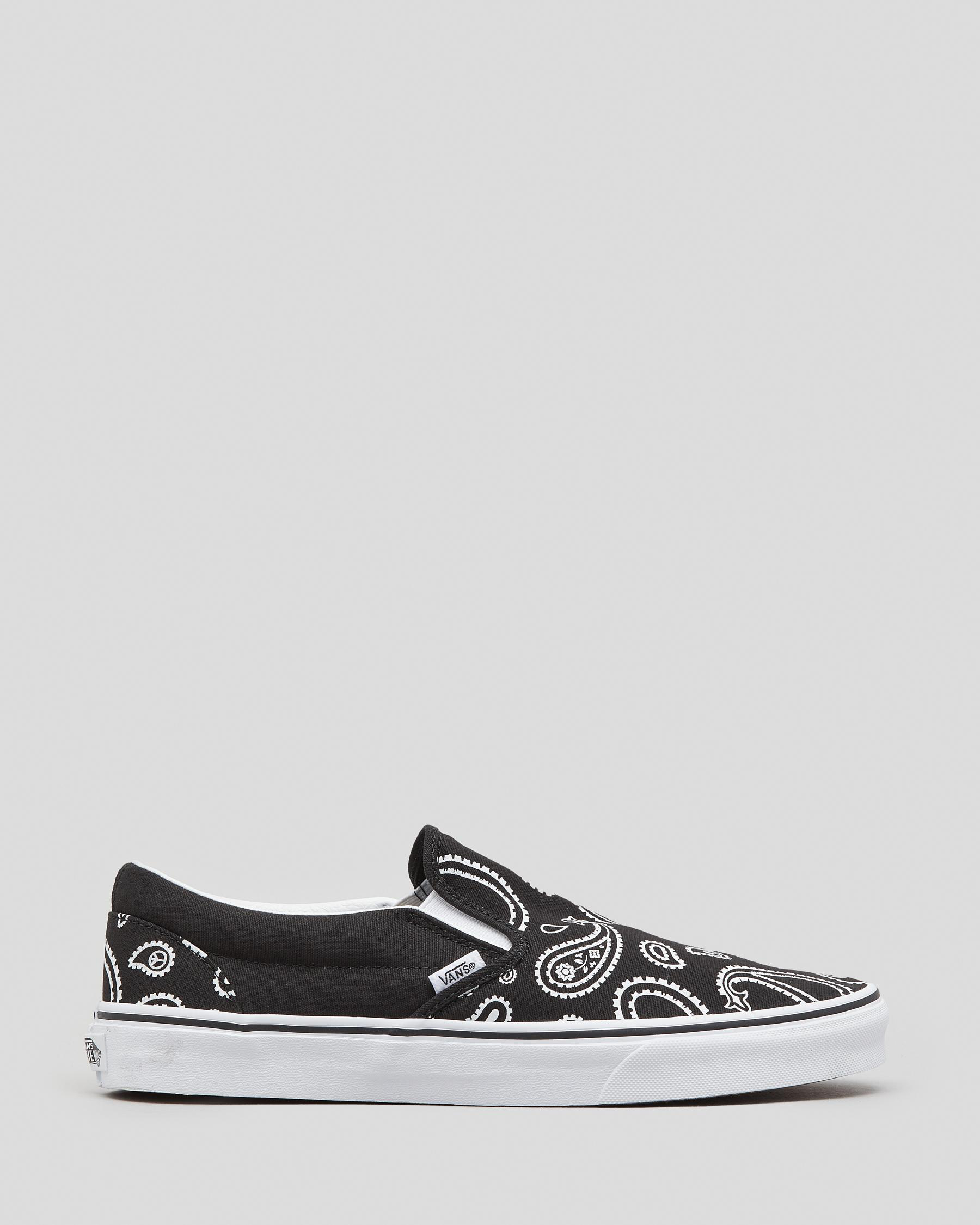 Shop Vans Classic Slip-On Shoes In Black/true White - Fast Shipping ...