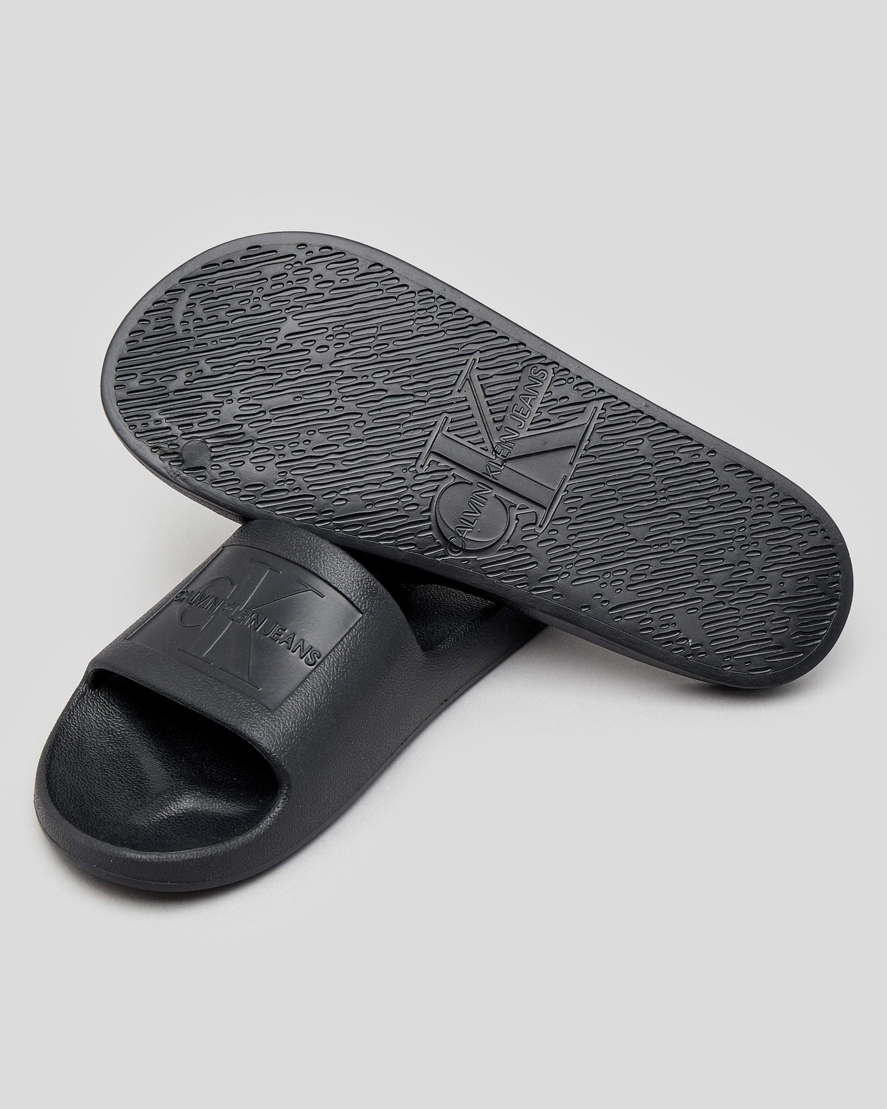 Shop Calvin Klein Debossed Eva Slide Sandals In Black - Fast Shipping ...